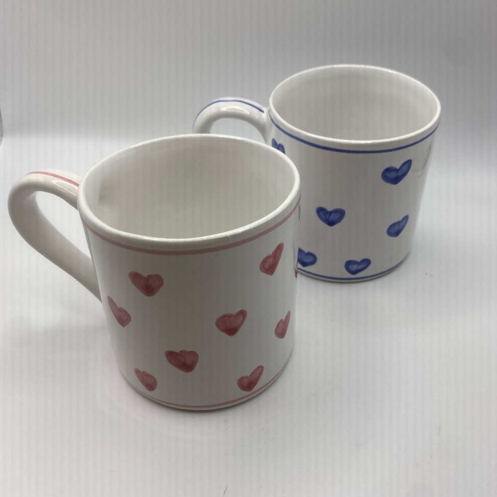 Two coffee mugs hand painted hearts in Portugal.